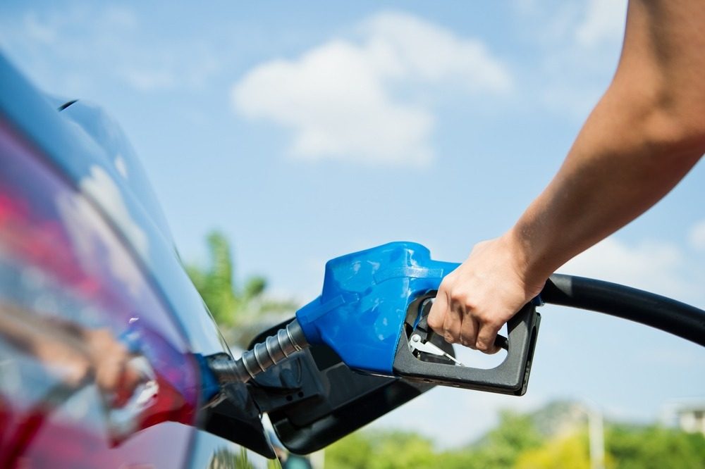 Person refuelling a vehicle