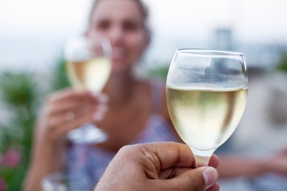 alcohol and drink driving: person drinking a glass of wine
