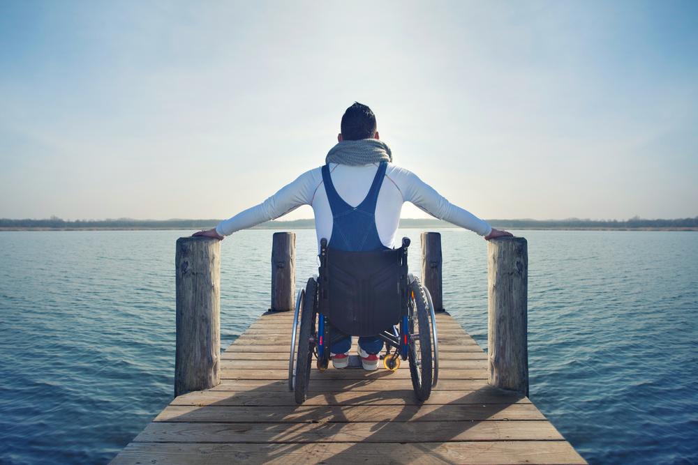 person in wheelchair travelling