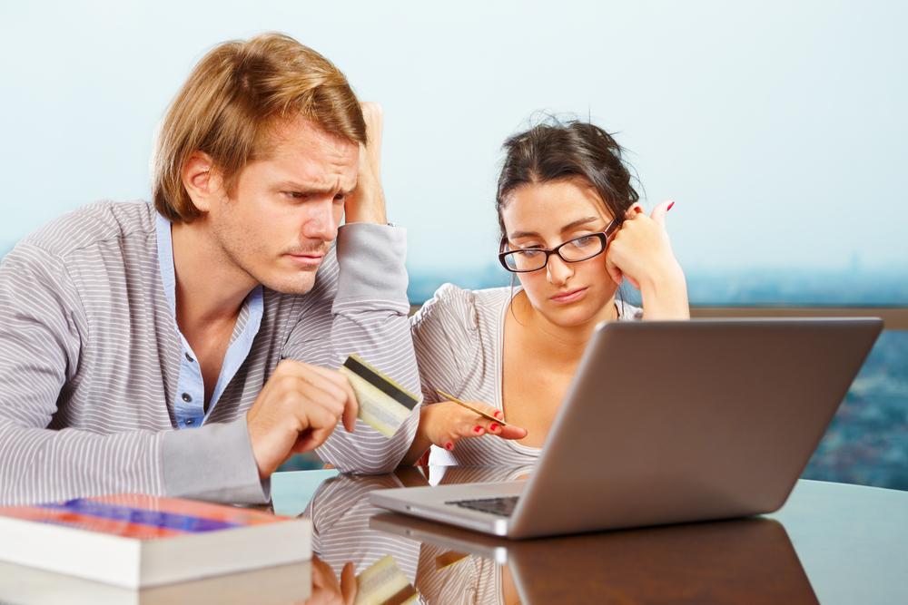 users in front of a computer with a blocked credit card