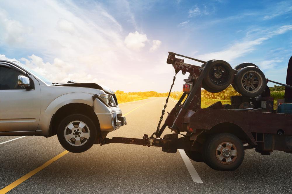 crashed car being towed
