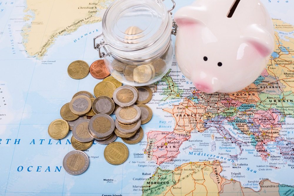 illustration of a map of Europe showing coins and a piggy bank