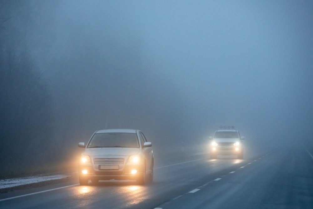 cars driving in fog